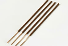 Load image into Gallery viewer, Close-up of the subtle, honeyed brown color and uniform shape of Amod Aromas traditional hand-dipped sticks.

